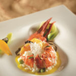 Maine Lobster and English Pea Risotto with shaved truffle and yellow tomato beurre fondue