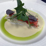 Butter-Baked Turbot with leek soubise, king crab, root celery nage and truffle pea tendrils