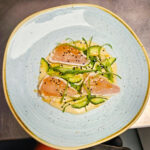 Wahoo Tataki with Miso Dressing, Pickled Cucumber, Toasted Sesame Seeds, Mike’s Hot Honey and Scallions 