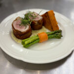 Bacon-Wrapped Noisettes of Pork Tenderloin with Sweet Potato Gratin, Bundled Asparagus and Grain Mustard Sabayon